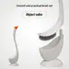 Brosse WC incurvée avec support, design ergonomique pour nettoyage efficace et rejet d'odeur.