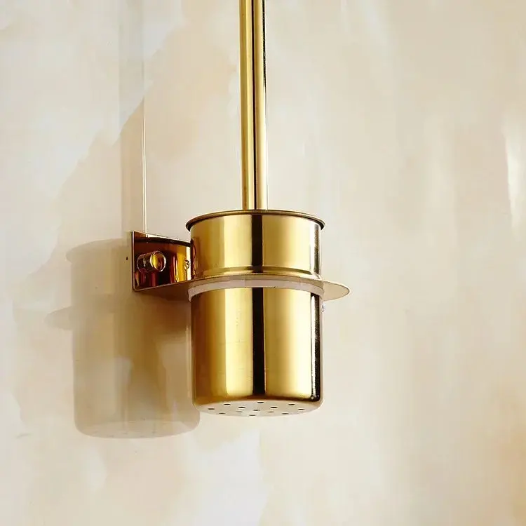 Brosse WC murale dorée, design élégant pour salle de bain.