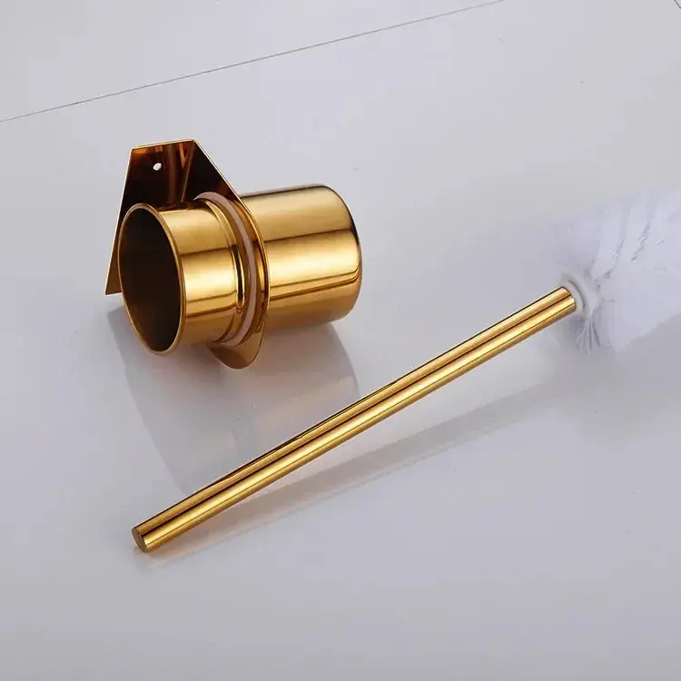 Brosse WC dorée murale avec support, design élégant pour salle de bain.