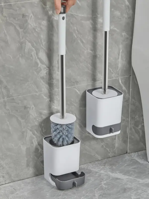 Brosse WC avec support mural, design moderne, rangement pratique pour salle de bain.